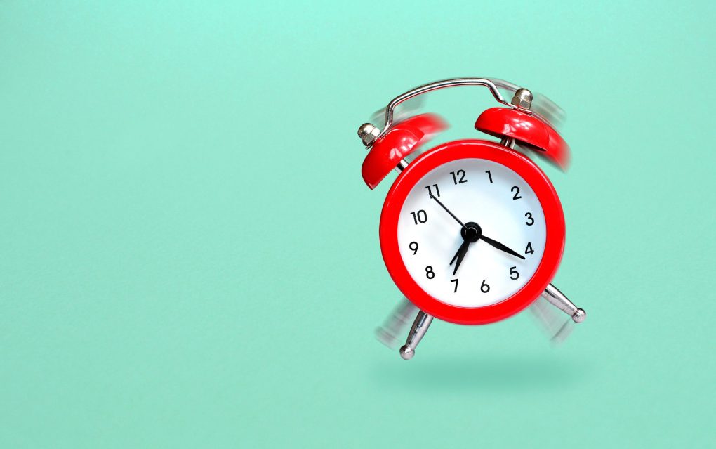 ringing-and-bouncing-red-alarm-clock-background